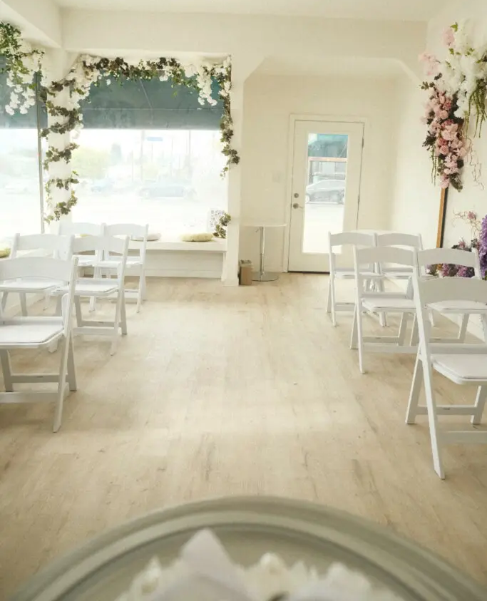 Wedding ceremony room with floral decorations.