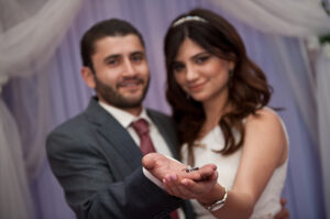 A couple presenting their rings