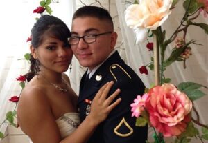 A couple embracing near beautiful flower decor